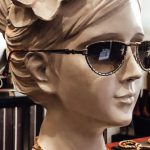 Marketing Trends - Bust sculpture of female in sunglasses and accessories placed on counter in vintage shop