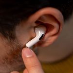 Listening Ear - Person in Yellow Sweater Wearing an Airpods Pro