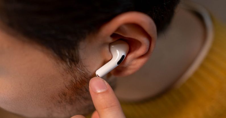 Listening Ear - Person in Yellow Sweater Wearing an Airpods Pro