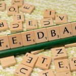 Feedback Loop - The word feedback is spelled out with scrabble tiles