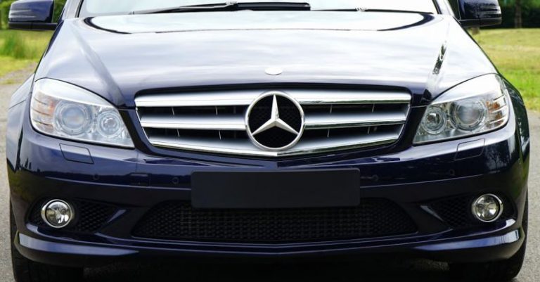 Luxury Branding - Blue mercedes Sedan Near Green Grass Field during Day Time