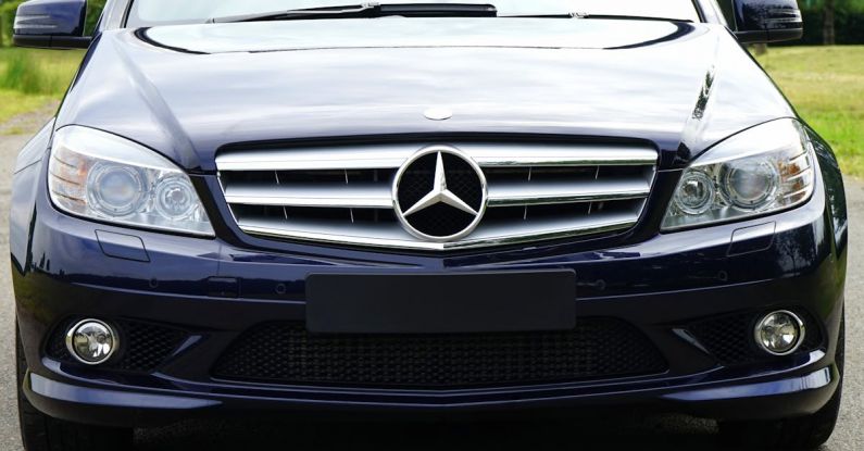 Luxury Branding - Blue mercedes Sedan Near Green Grass Field during Day Time