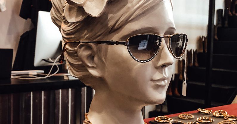 Marketing Trends - Bust sculpture of female in sunglasses and accessories placed on counter in vintage shop