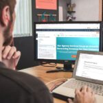 Blogging - man sitting on chair using silver laptop
