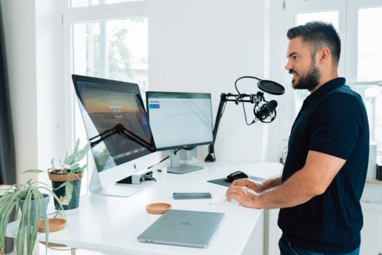 Influencer - man in black t-shirt sitting at the table
