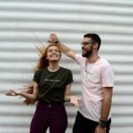 Influencer - man and woman standing while chatting