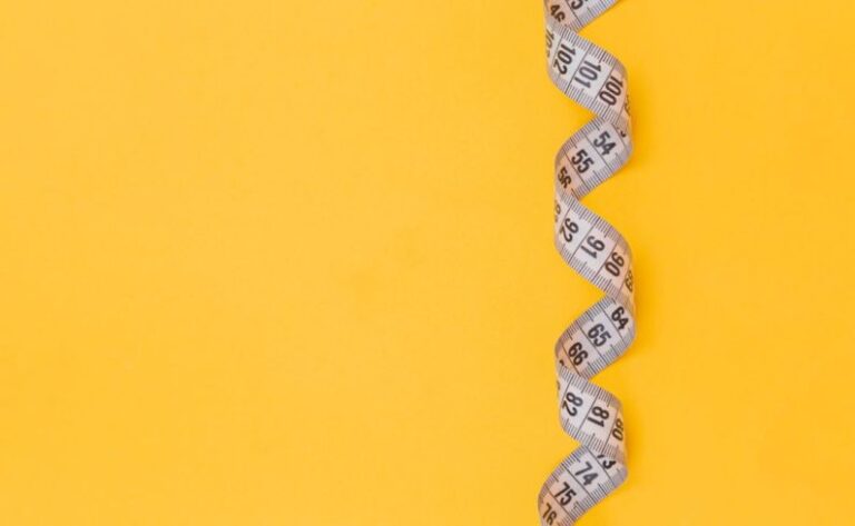 Measuring - black and white snake on yellow background