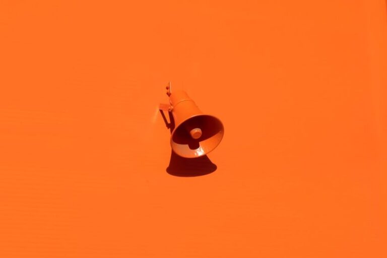 Brand - orange megaphone on orange wall